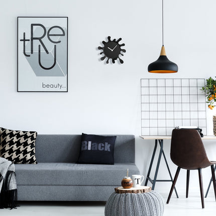 Horloge murale noire, design unique en forme d'éclaboussure