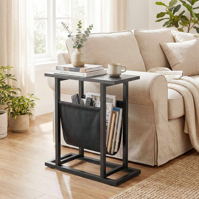 Table d'appoint compacte noire avec structure en acier et poche en tissu