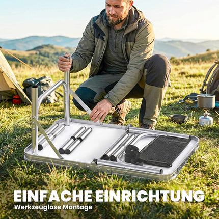 Table de camping pliante en aluminium avec filet et hauteur réglable.