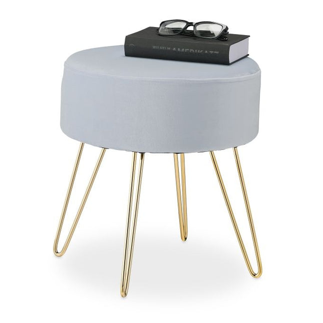 Samthocker mit goldenen Beinen